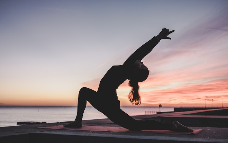 Person meditating peacefully with calming guided meditation audio for beginners